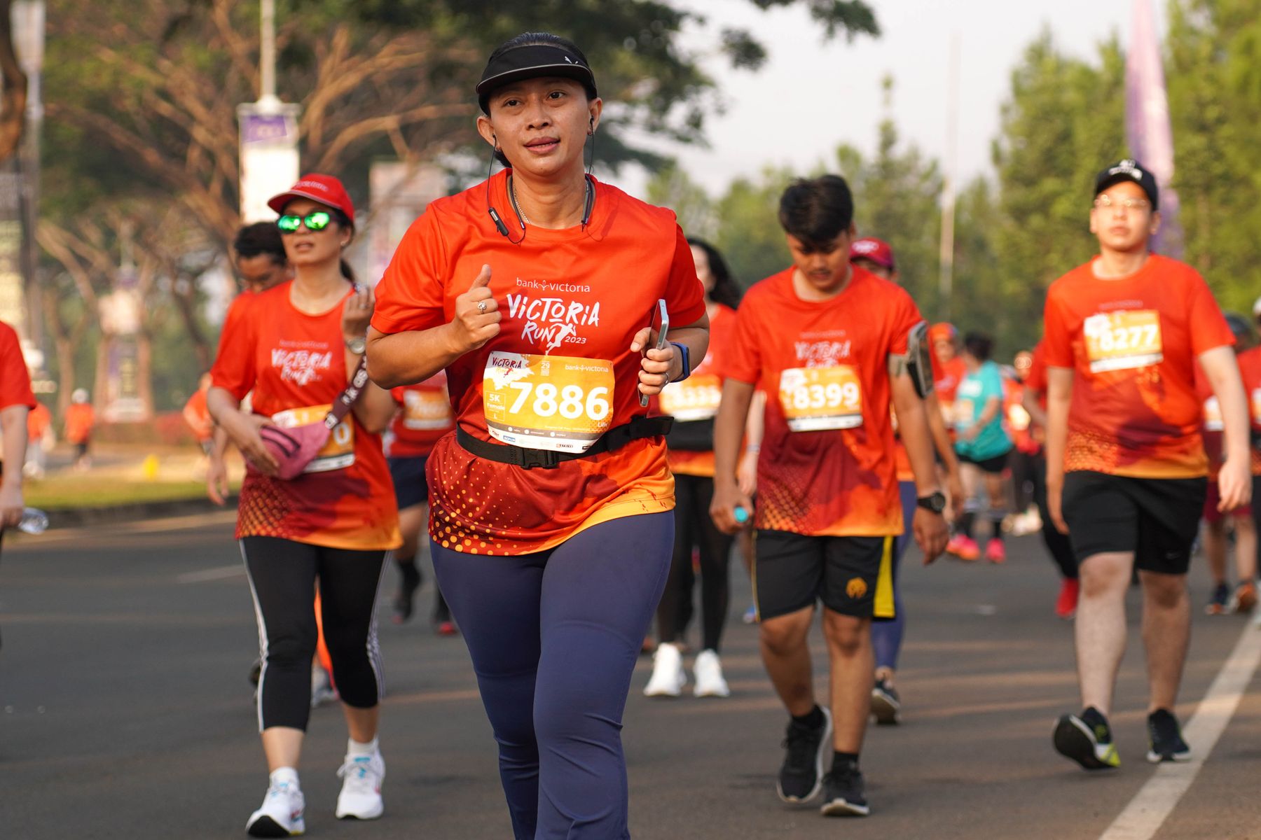Runners moving together along a city street